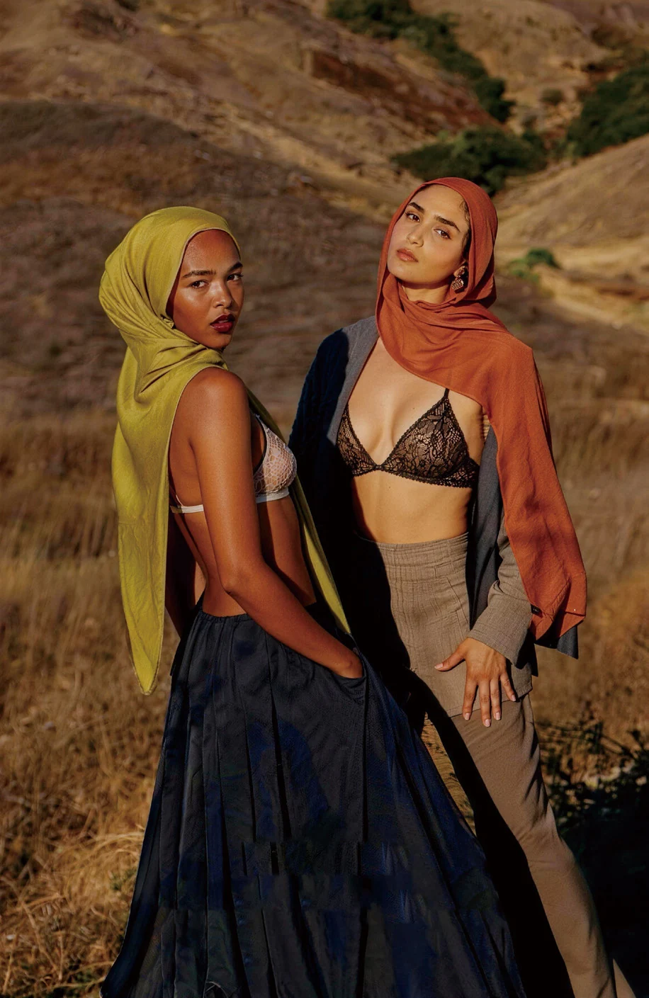 Two women wearing colorful scarves and intimate wear in the Color Kiss brand proposal